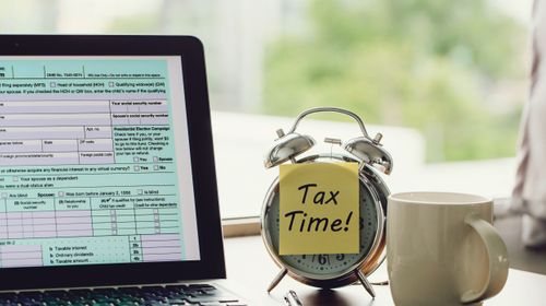 tax-time-concept-tax-time-postit-alarm-clock-individual-income-tax-return-form-online